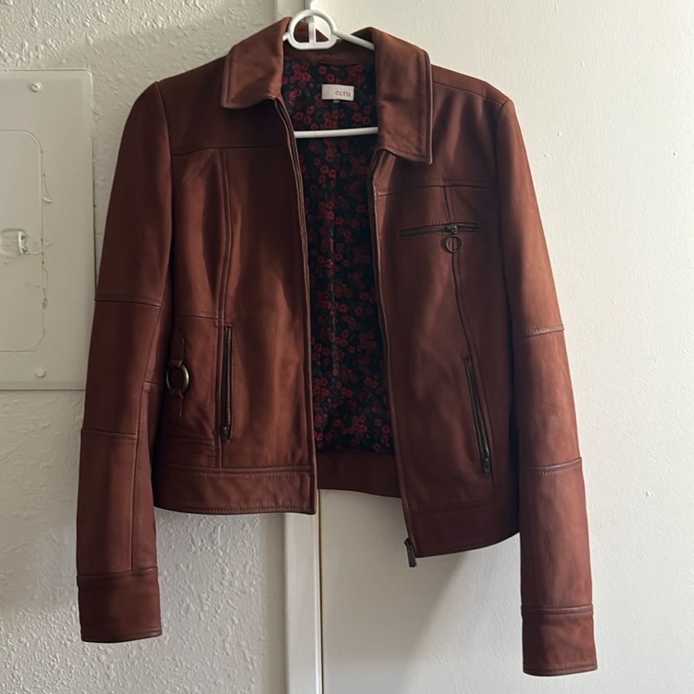 Brown leather jacket with flower pattern inside